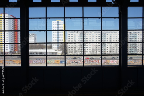 View on buildings through big glass window in Berlin