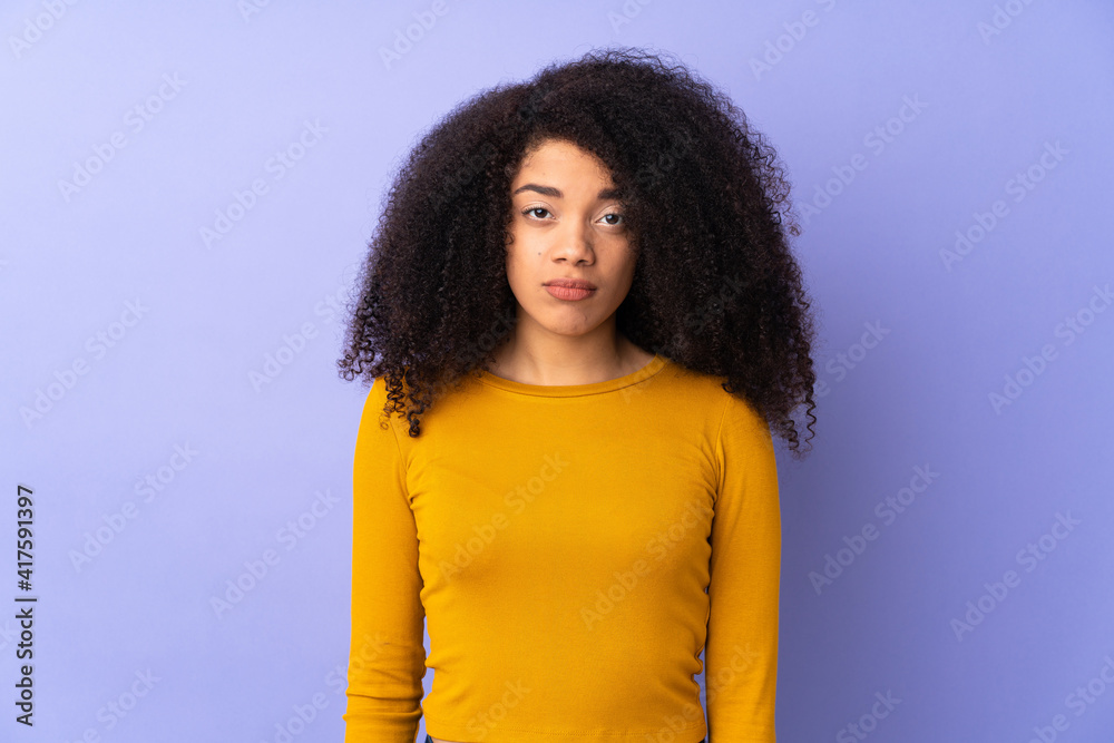 Young african american woman isolated on purple background with sad expression Young african american woman isolated on purple background with sad expression