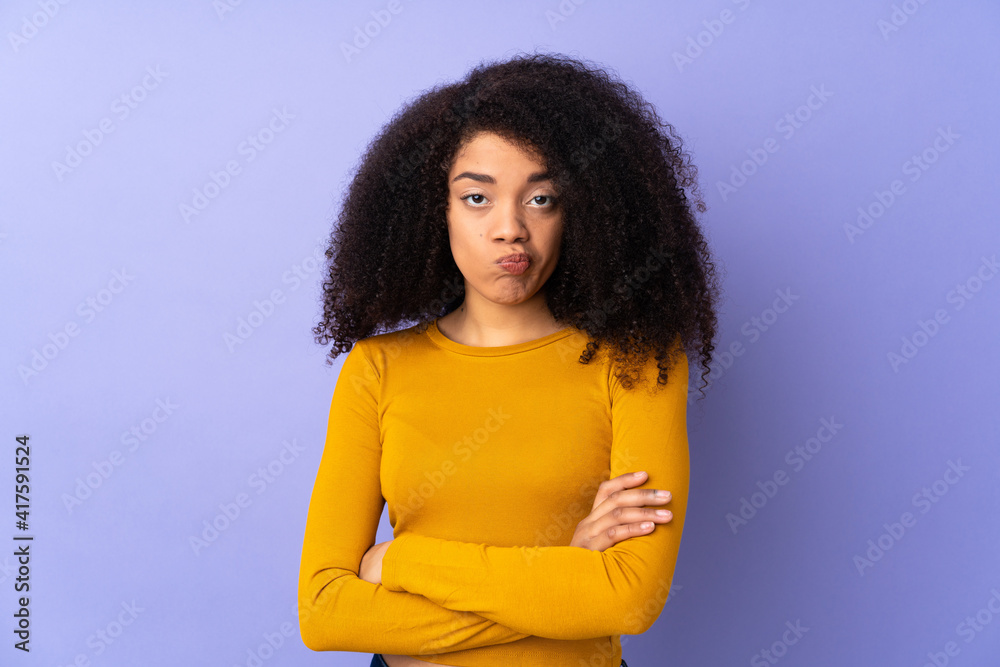 Young african american woman isolated on purple background feeling upset Young african american woman isolated on purple background feeling upset