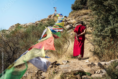 Canvas Print A monk walking and praying in a Buddhist temple in the Alpujarras of Granada, Sp