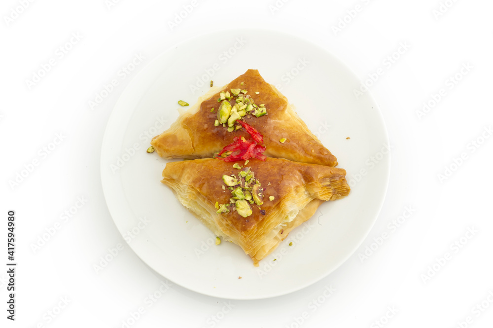 Oriental Arabic sweet warbat with qishta, kadayif, kunafa, with pistachio and cheese.
