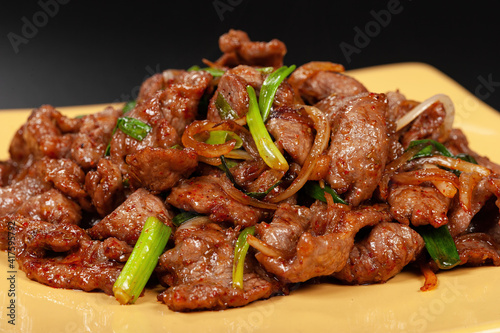 Chinese WOK dish. The lamb in the spices with the onions. © Sergey