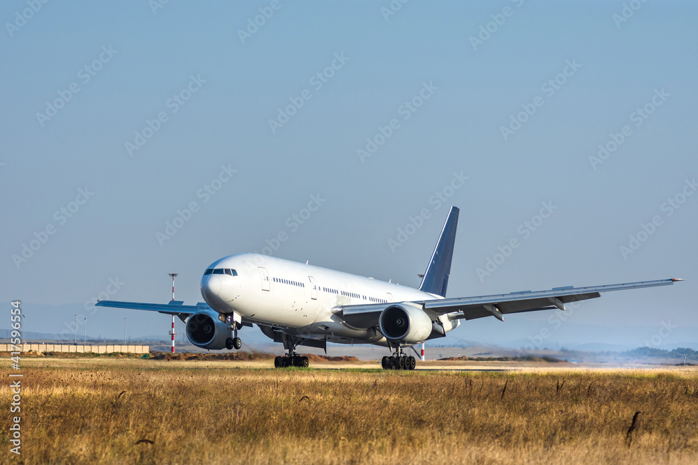 Airplane is landing at the airport Airplane is landing at the airport