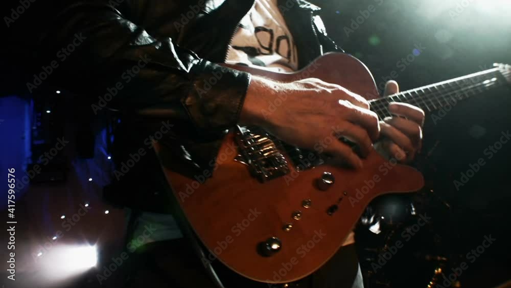 Rock Guitarist playing guitar at a live concert