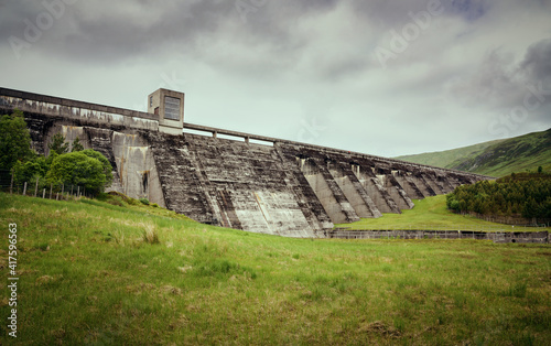 Fototapeta Naklejka Na Ścianę i Meble -  The dam wall of Loch Daimh reservoir water supply in the Scottish Highlands, UK landscapes.
