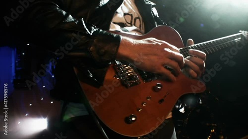 Rock Guitarist playing guitar at a live concert