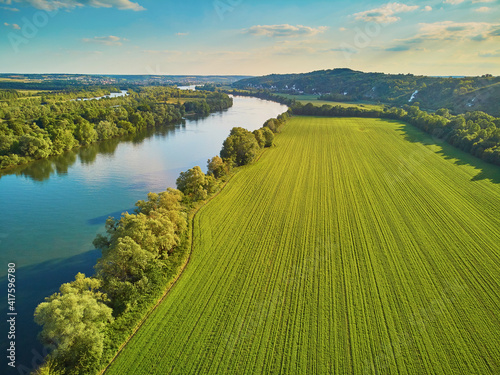 Scenic aerial view of the Seine river and green fields in French countryside