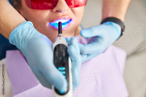 Usage of blue dental curing lights on patient