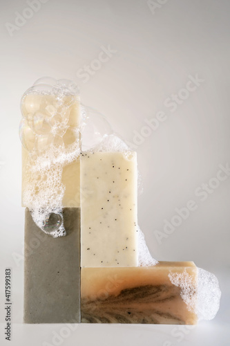 Принти на полотні Soap with foam stands on a white background.