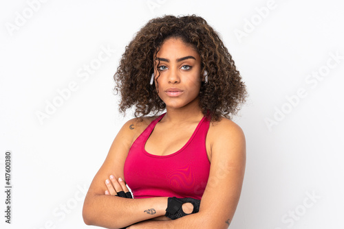 Young African American sport woman isolated on white background keeping the arms crossed