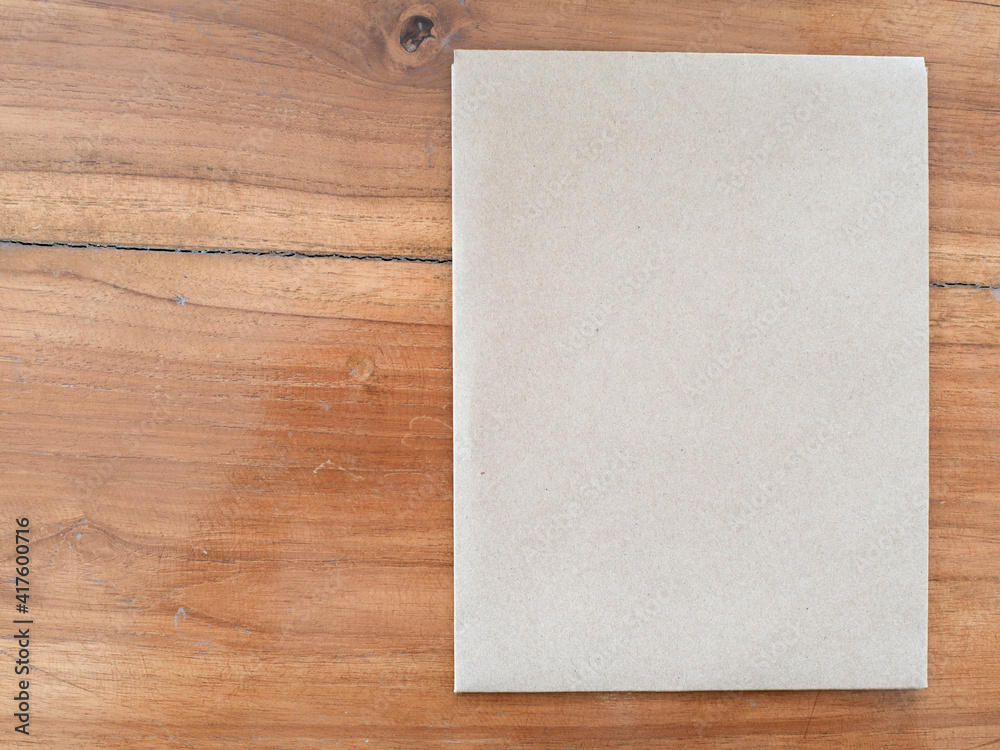 A hand holding a paper envelope A hand holding a paper envelope