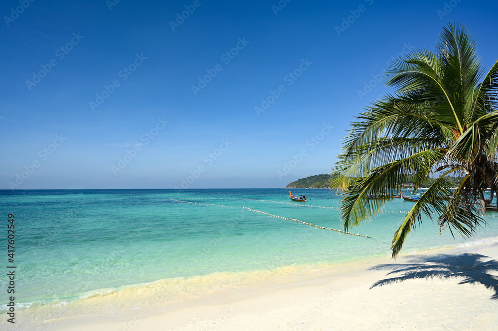 Coconut trees on the beautiful white beaches of the South. Andaman Sea, Thailand