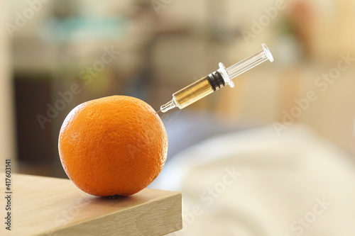 Close up of a injection into an orange photo