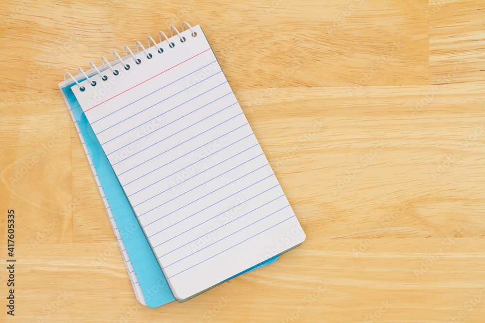 Retro lined paper notepad on a desk Retro lined paper notepad on a desk