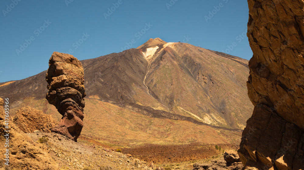 Roques de Garcia stone and Teide mountain volcano at the sunny morning in the Teide National Park, Tenerife, Canary Islands, Spain.