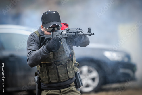 Military army soldier in action tactical combat shooting from rifle machine gun. Shooting and weapons. Outdoor shooting range