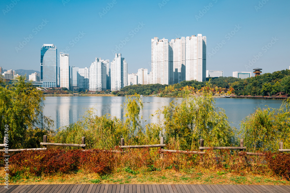 View of modern skyscrapers and Gwanggyo Lake Park at autumn in Suwon, Korea