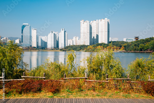 View of modern skyscrapers and Gwanggyo Lake Park at autumn in Suwon, Korea