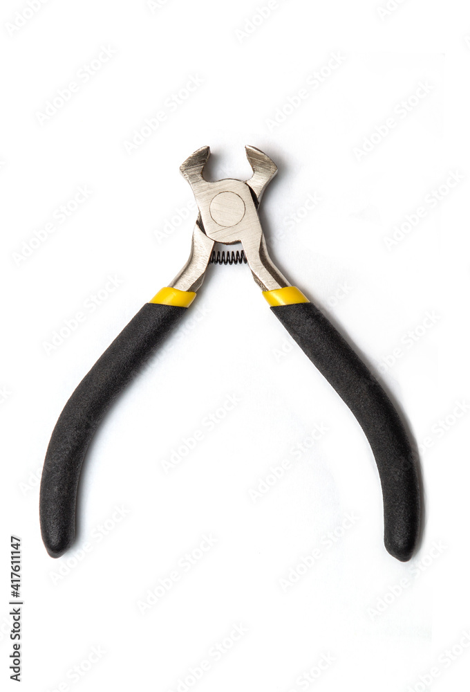 Pincers tool for stripping wires in electricity. White isolated background Pincers tool for stripping wires in electricity. White isolated background