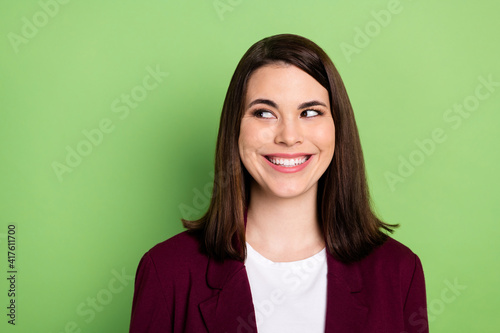 Photo of nice optimistic brown hairdo lady look empty space wear red cardigan isolated on pastel green color background