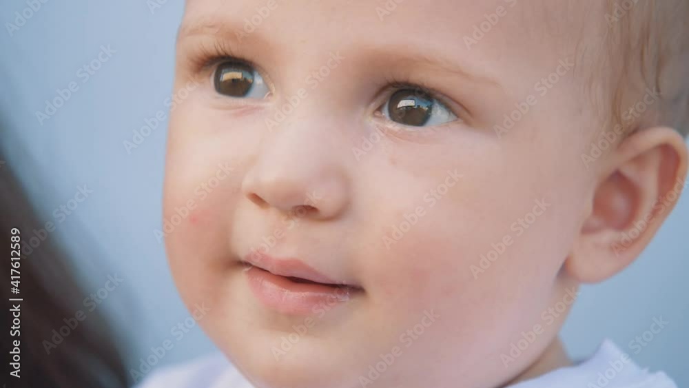 Beautiful happy family. Smiling baby face. Happy family. Happy baby face. Macro close-up of a kid face. Happy family concept Beautiful happy family. Smiling baby face. Happy family. Happy baby face. Macro close-up of a kid face. Happy family concept