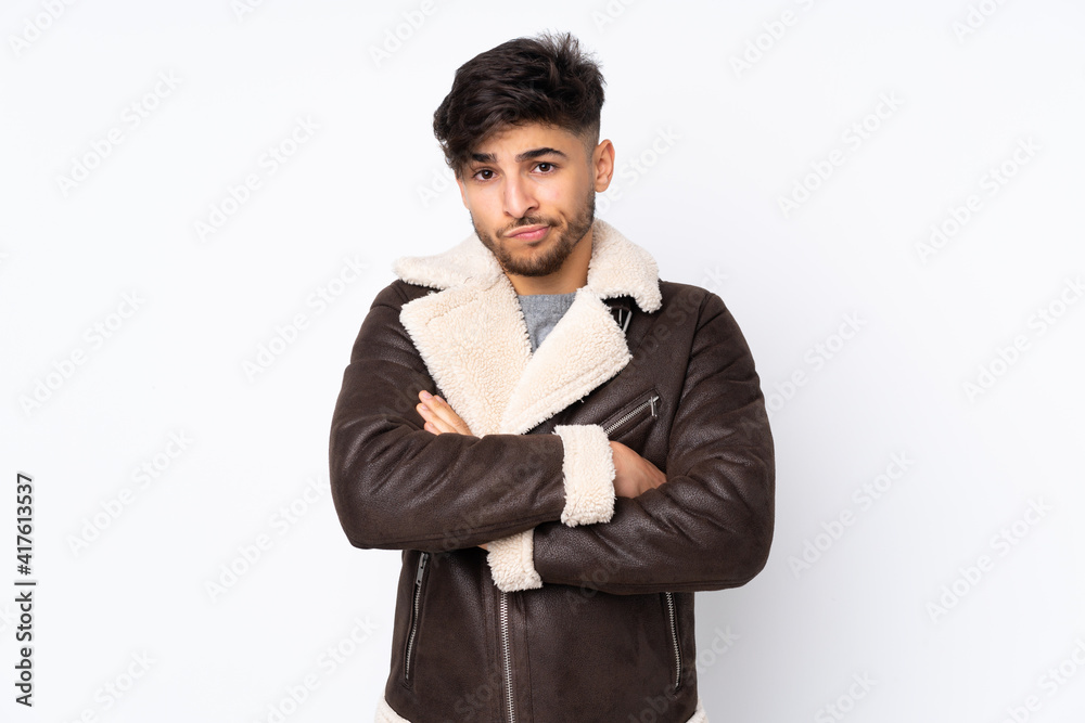 Arabian handsome man over isolated background with unhappy expression