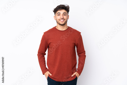 Arabian handsome man over isolated background laughing