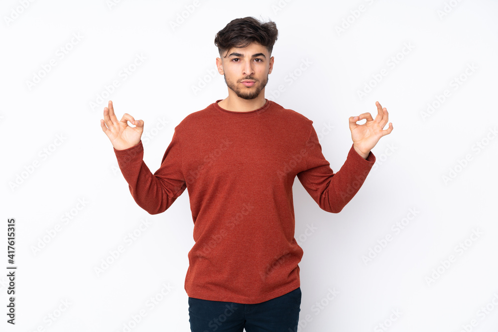 Arabian handsome man over isolated background in zen pose Arabian handsome man over isolated background in zen pose