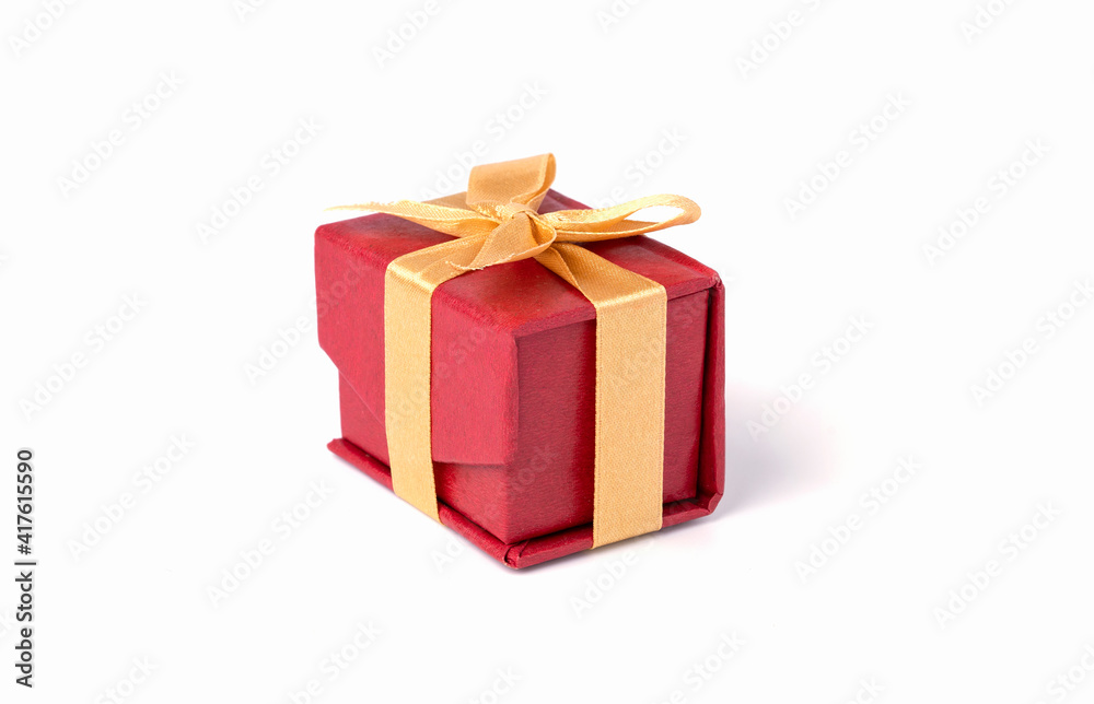 Red gift box and golden ribbon on white and bokeh background, Happy birthday and happy new year concept. Red gift box and golden ribbon on white and bokeh background, Happy birthday and happy new year concept.
