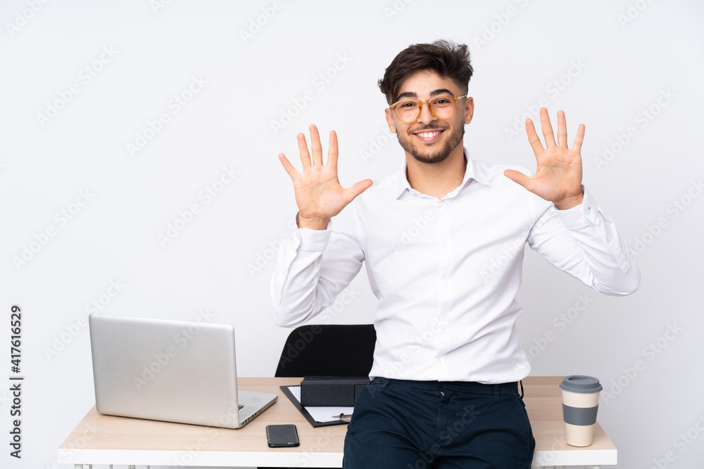 Arabian man in a office isolated on white background counting ten with fingers Arabian man in a office isolated on white background counting ten with fingers