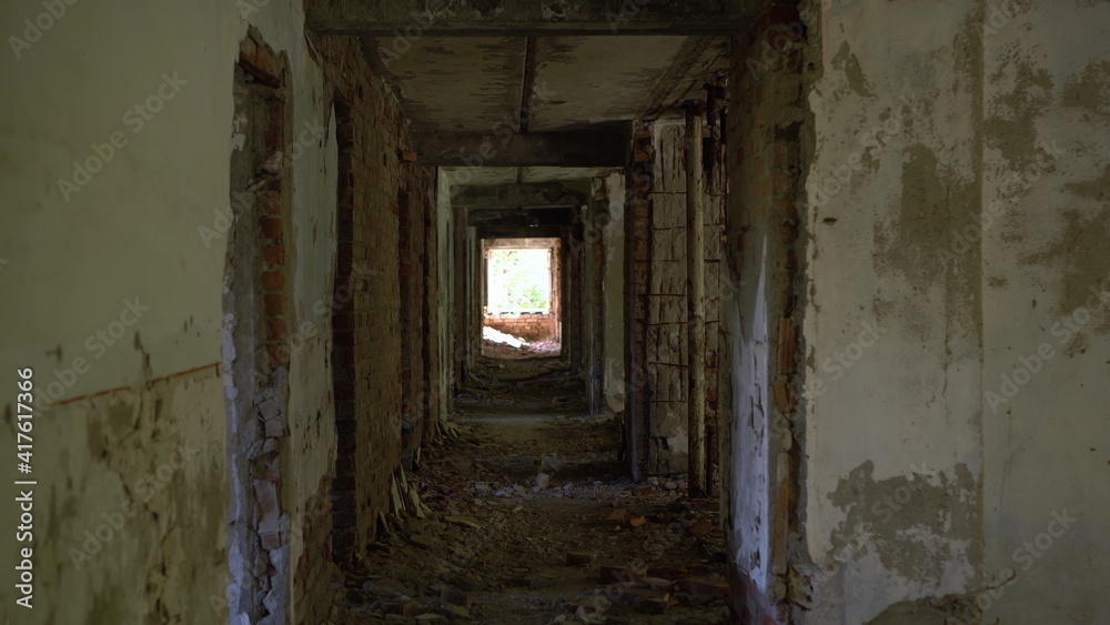 Passage along the corridor of an old abandoned building.