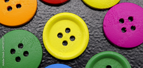 close-up colorful buttons for sewing on background