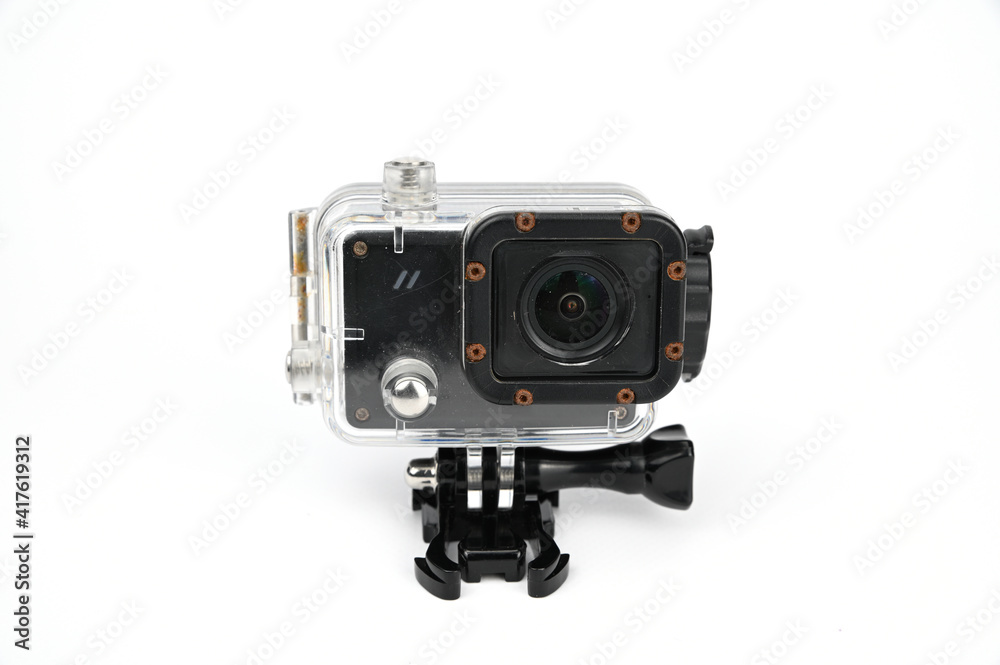 Action camera inserted into a transparent waterproof box on a stand with a large fastening screw.