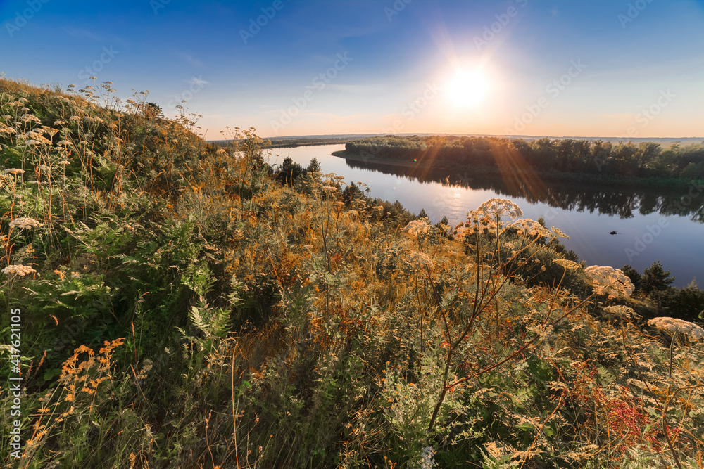 Obraz premium sunset over the river