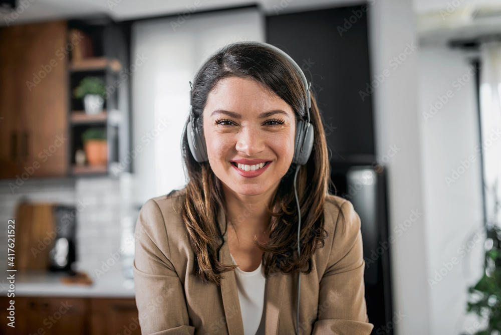Young business woman working from home sitting in front of laptop computer having meeting over internet. Woman entrepreneur. Young business woman working from home sitting in front of laptop computer having meeting over internet. Woman entrepreneur.
