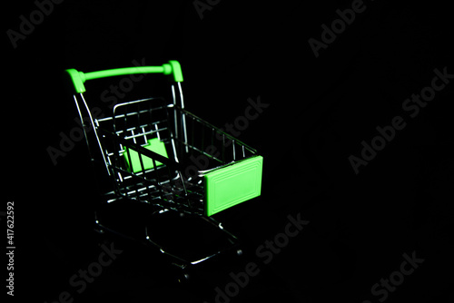shopping cart  on dark background. Shopping or e-commerce. security shopping concept. © setthawuth