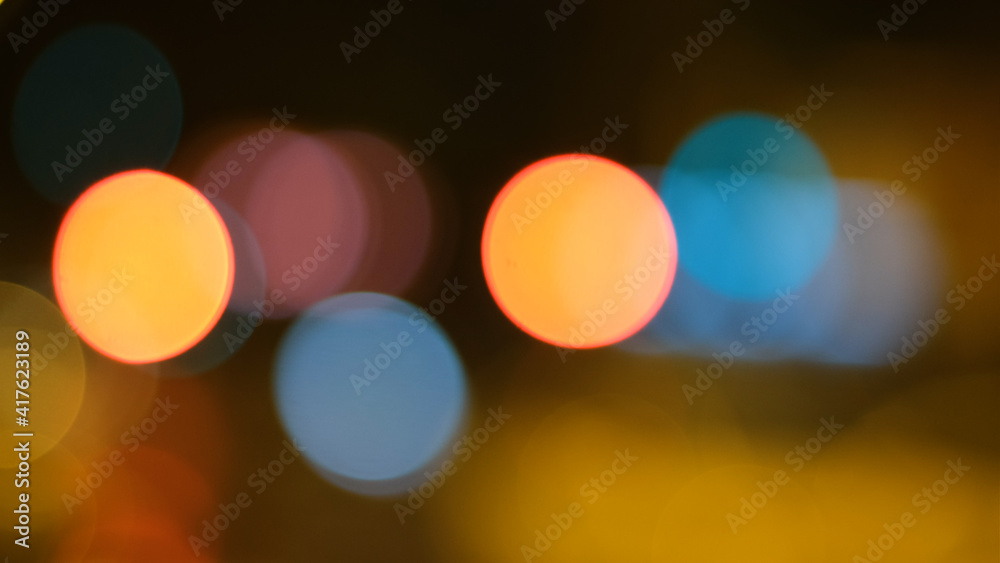 Abstract background of city lights bokeh. Blurred city lights . Defocused blurred lights. City at night . Traffic light. Traffic light bokeh. City bokeh night light .