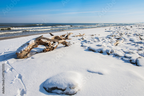 Snow on the beach and the frozen Baltic Sea. Beautiful winter landscape 