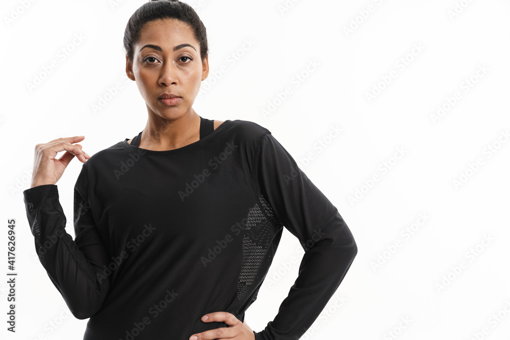 Confident african american woman posing and looking at camera Confident african american woman posing and looking at camera
