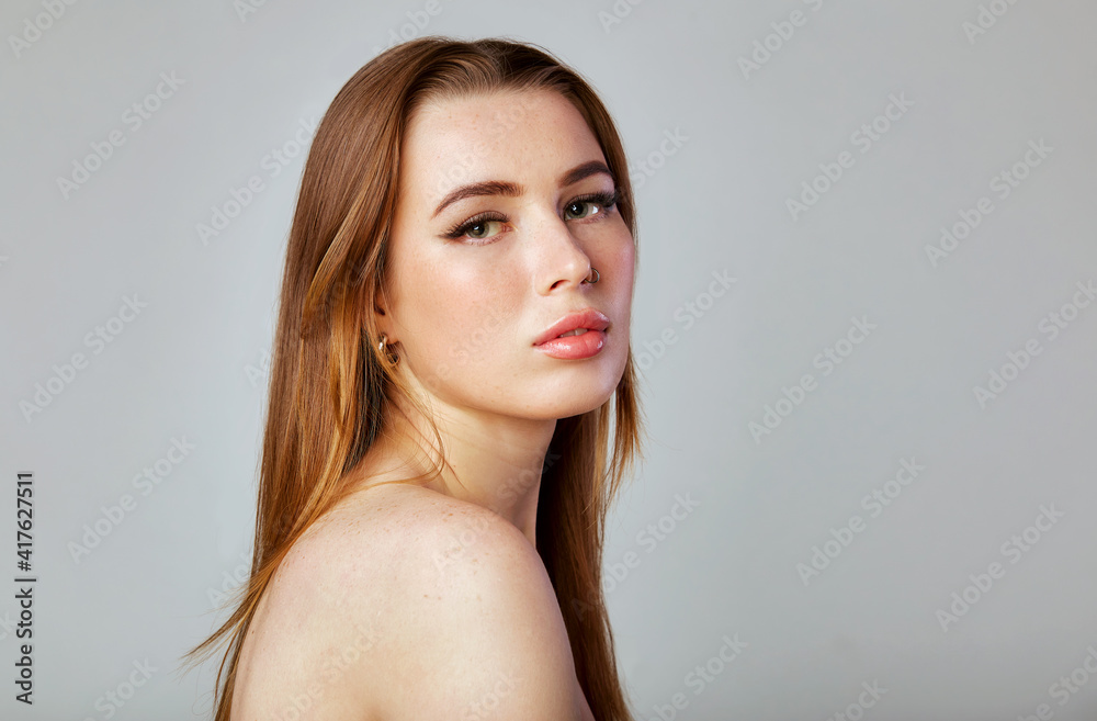 Closeup portrait of a face of the young pretty woman with a healthy skin. Beautiful face of young white woman with a clean skin. Skin care concept. Closeup portrait of a face of the young pretty woman with a healthy skin. Beautiful face of young white woman with a clean skin. Skin care concept.