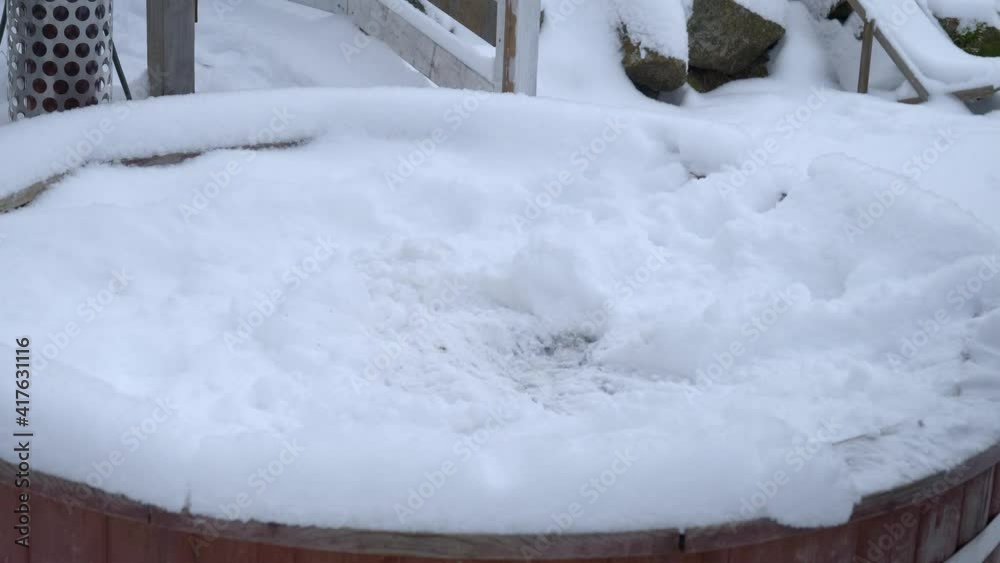 Close view of a person hammering snow to break the ice. Close view of a person hammering snow to break the ice.