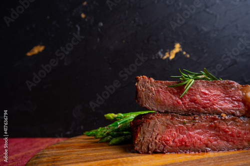 grilled venison fillet on wooden table close up