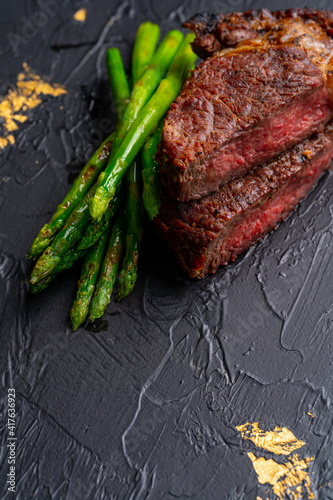 grilled venison fillet on wooden table close up