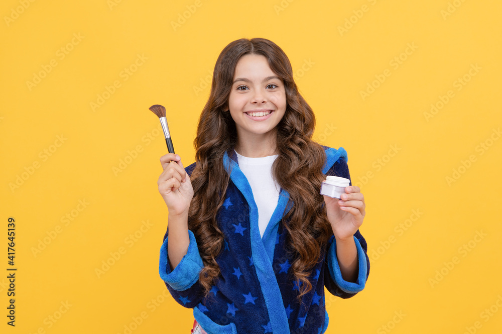 real happiness. smiling child in pajama or bathrobe use cosmetics. morning grooming. real happiness. smiling child in pajama or bathrobe use cosmetics. morning grooming.