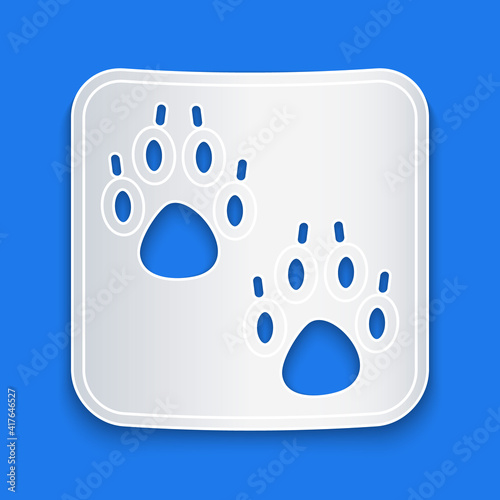 Paper cut Paw print icon isolated on blue background. Dog or cat paw print. Animal track. Paper art style. Vector.