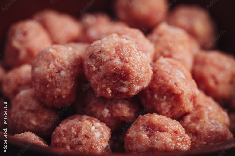 Raw home made Italian traditional meatballs Raw home made Italian traditional meatballs