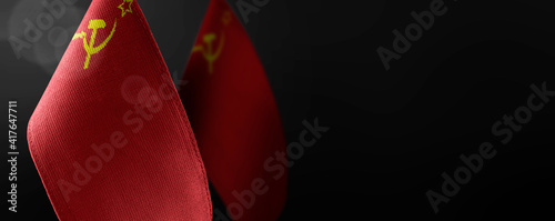 Fotografi Small national flags of the USSR on a dark background