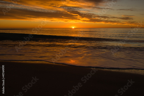 A beautiful sunrise from the shore of the beach