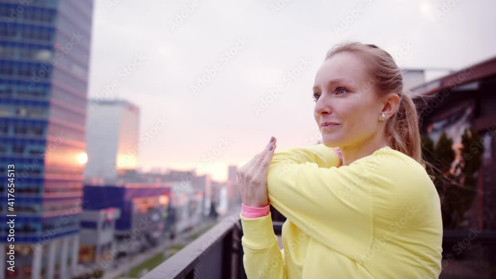 Young woman doing stretching after run. Young woman doing stretching after run.