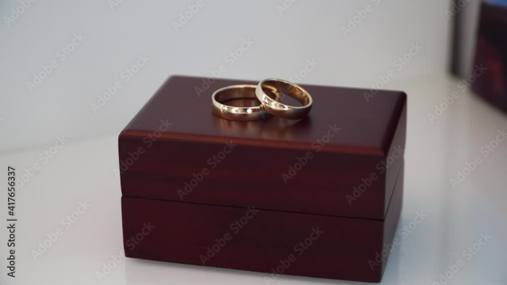 gold wedding rings on a wooden box gold wedding rings on a wooden box